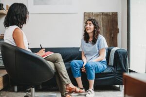 a therapist talks with a client about common Misconceptions about Therapy