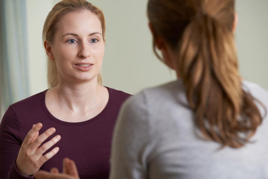 a client listens as a therapist talks about the benefits of Individual Therapy