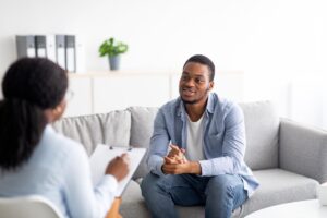 a client listens while a therapist answers "What is Individual Therapy?"